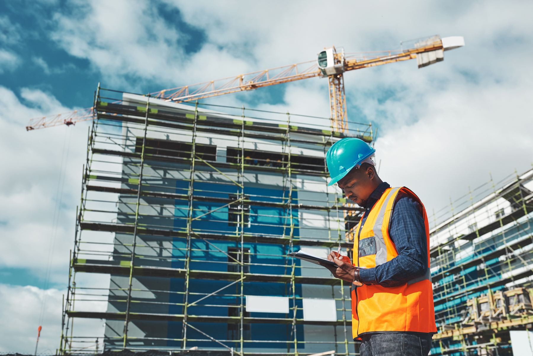 Construction manager reviewing a project schedule on a tablet